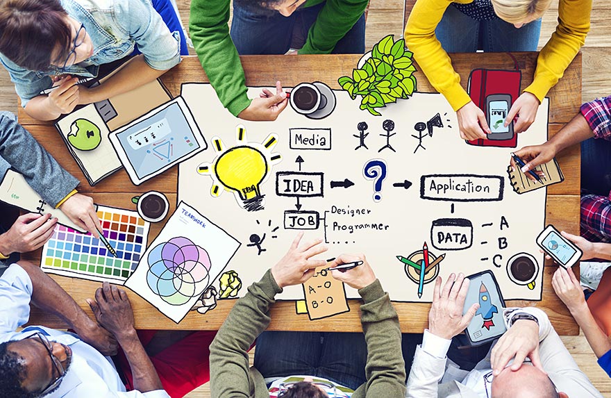 Group of people brainstorming ideas on a table